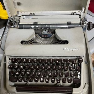 Vintage 1950s Olympia Manuel typewriter with hard case